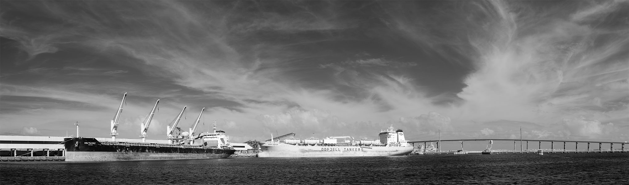 Infrared Panorama of Bulk Carrying Ships at Wharf with Dramatic Sky